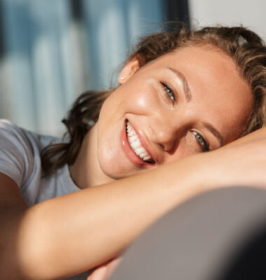 Smiling pretty blonde young woman wearing casual clothes